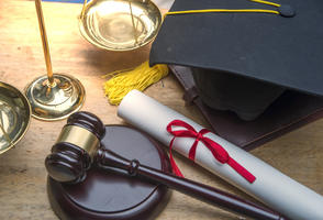 table with diploma and gavel